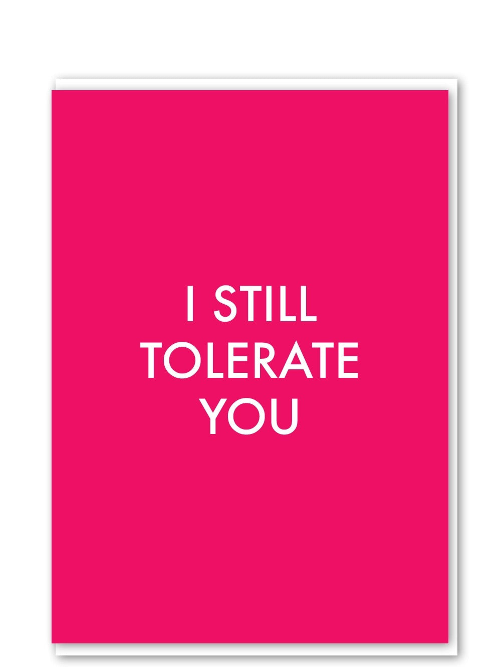 Pink greeting card with white text reading  'I STILL TOLERATE YOU'.
