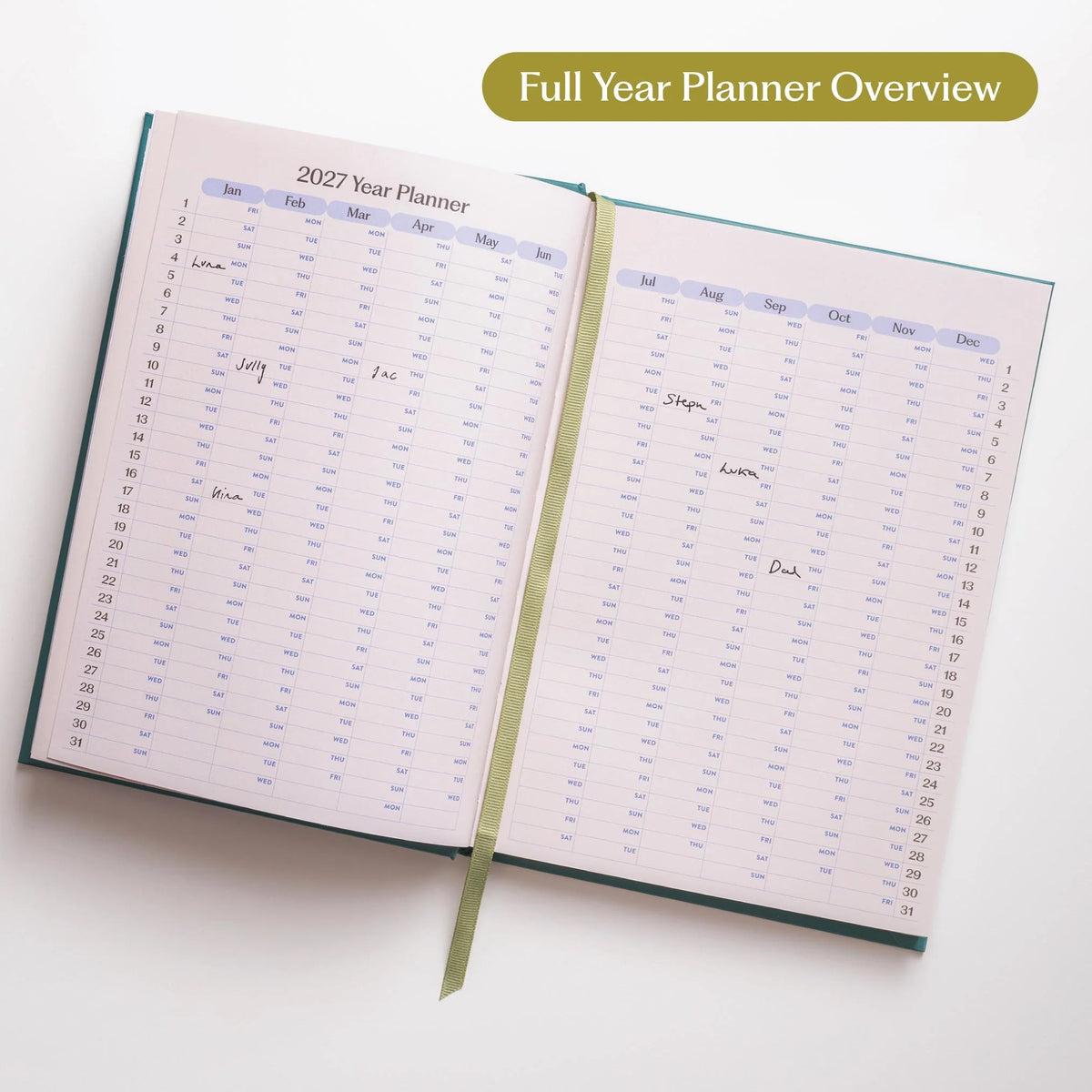 An open 2027 diary showing a double page spread with a 2027 yeqar planner and green ribbon bookmark against a white background.