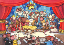 A colorful cartoon illustration of a nativity scene featuring mice dressed as angels, wise men, shepherds, and a baby in a manger, with red curtains framing the stage-like composition.