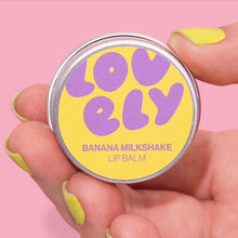 Lip balm container labeled 'Lovely' with 'Banana Milkshake' flavour on a pink background.