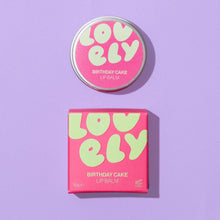 Lovely Skincare Birthday Cake lip balm with packaging on a purple background background.