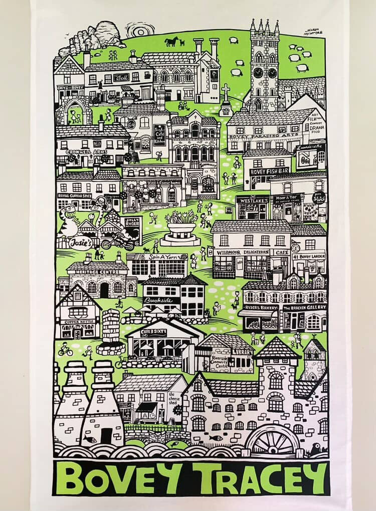 Tea towel featuring illustration of Bovey Tracey with green and black design on a white background