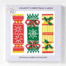 Three colourful and patterned Christmas crackers feature on a joyful Christmas card, n a boed pack of 6