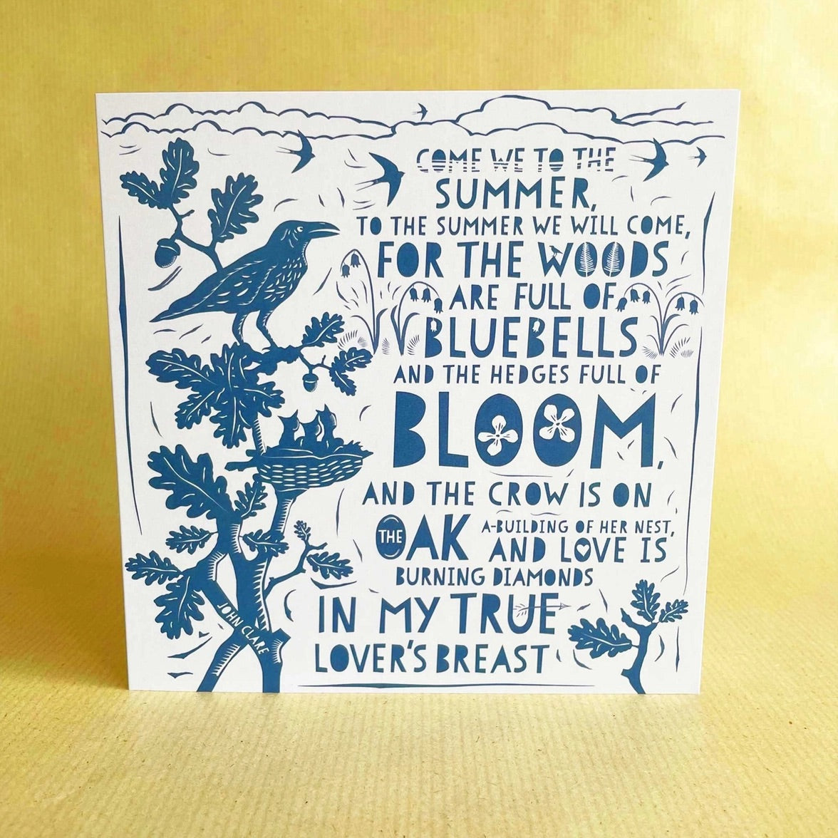 Card with blue nature-themed design and text on a yellow background