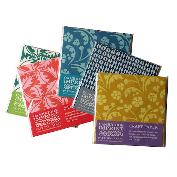 Cambridge Imprint craft paper packs with various patterns on a white background
