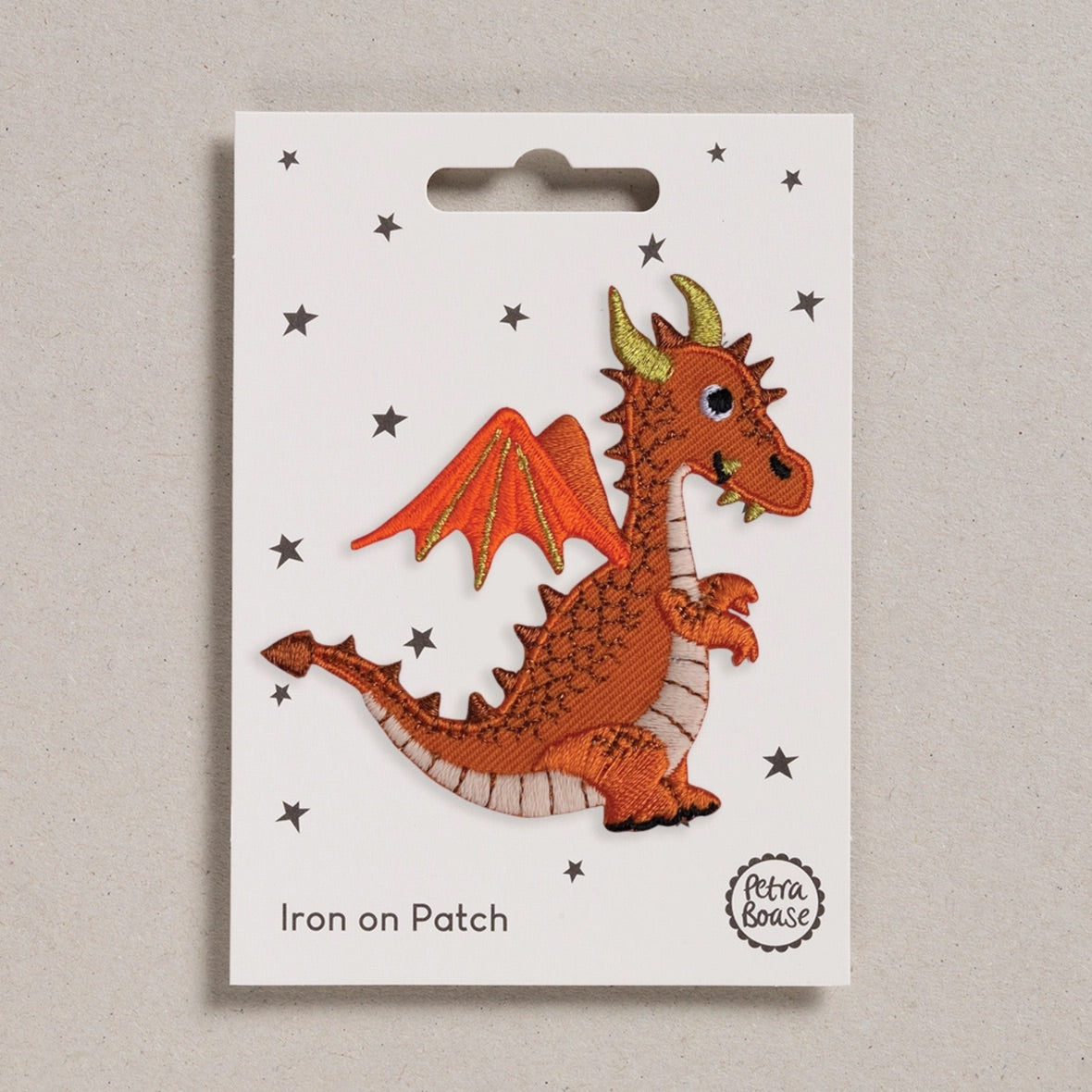 Dragon iron on patch on a white card with 'Petra Boase' branding.