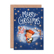 Christmas card with a child sleeping under a blanket, surrounded by stars and lights.