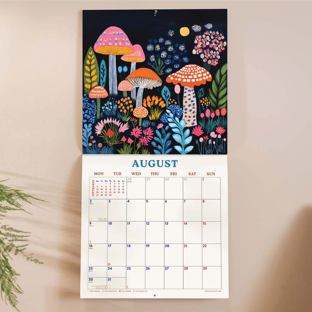 Calendar with a colorful mushroom and floral design on a beige background