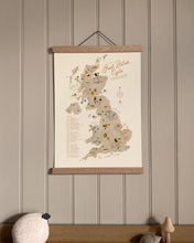 Map of the UK featuring the Great British Cycle by Oldfield Designs in wooden hanger and hanging against a taupe wall