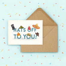 Greeting card with colorful hats and 'THAT'S OFF TO YOU!' text on a blue background with confetti.