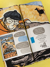 Packaged tea towel featuring Dartmoor Huggable Rock design by Sarah McIntyre