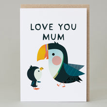 Greeting card with cartoon puffin and penguin illustration and 'LOVE YOU MUM' text on a white background.