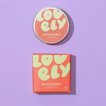 Lovely Skincare's Mango Sorbet lip balm with packaging on a purple background