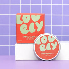 Lovely Skincare's mango sorbet lip balm with packaging on a purple grid background