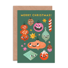 Christmas card with colourful smiley ornaments on a green background