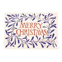 A Christmas greeting card with an off-white background, featuring a navy blue leafy wreath with small red berries and the words 'MERRY CHRISTMAS' in red lettering in the center.