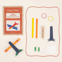 Model airplane kit with components and packaging on a white background