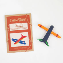 Cotton Twist model airplane kit with completed colourful aeroplane on a white background