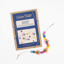 Make-your-own rainbow bracelet kit with cardboard packaging on a white background