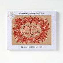 Charity Christmas Cards box featuring a red decorative holiday wreath and the words 'SEASONS GREETINGS' on a kraft paper-style card design.