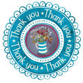 Thank you card with the wording 'Thank You' arranged circular in a wreath surrounding a nice jug of flowers.