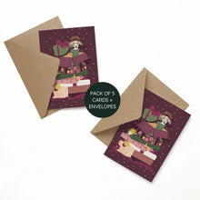 A pack of 5 greeting cards with matching kraft paper envelopes. The cards feature a whimsical illustration of a dog wearing a crown and holding a stack of presents, set against a dark plum background with white stars.