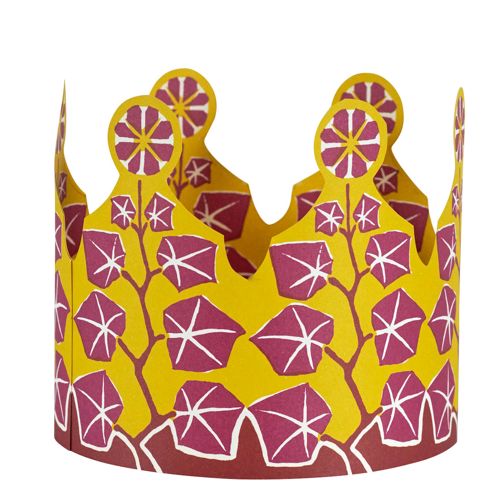 Decorative paper crown with maroon leaf and floral pattern on a yellow background by Cambridge Imprint